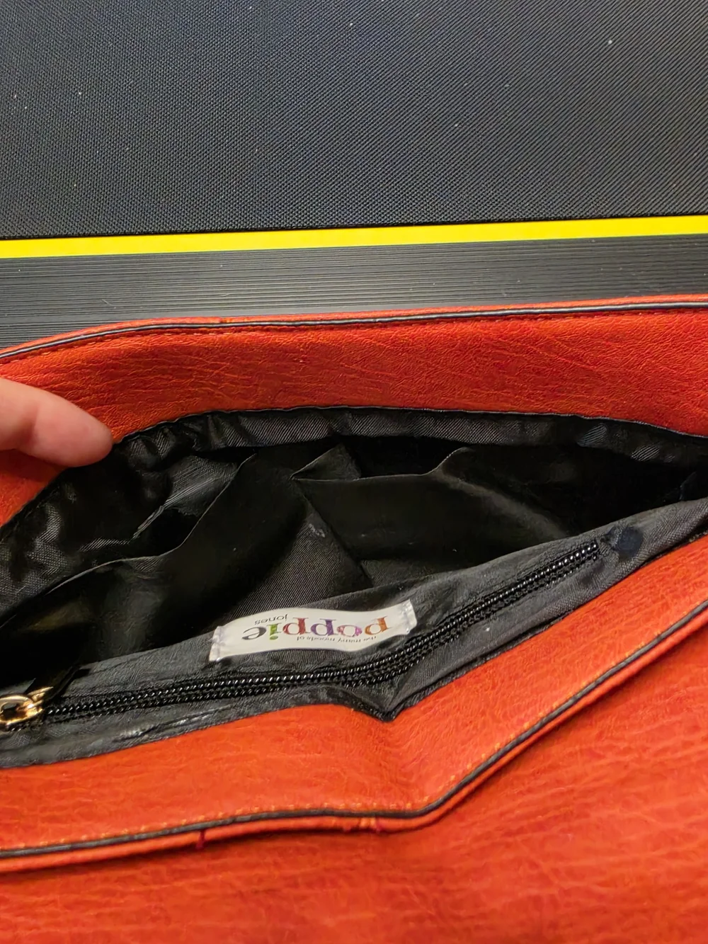 Poppie Jones Orange Leather Fold-Over Clutch with Brass Accents